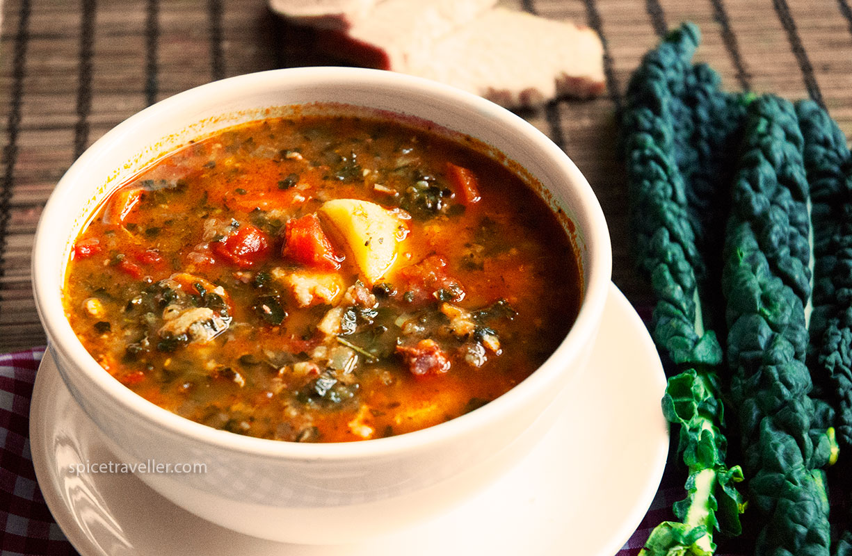 Hearty Ribollita Soup in a Bowl - A comforting and nutritious Tuscan vegetable and bean soup garnished with fresh herbs