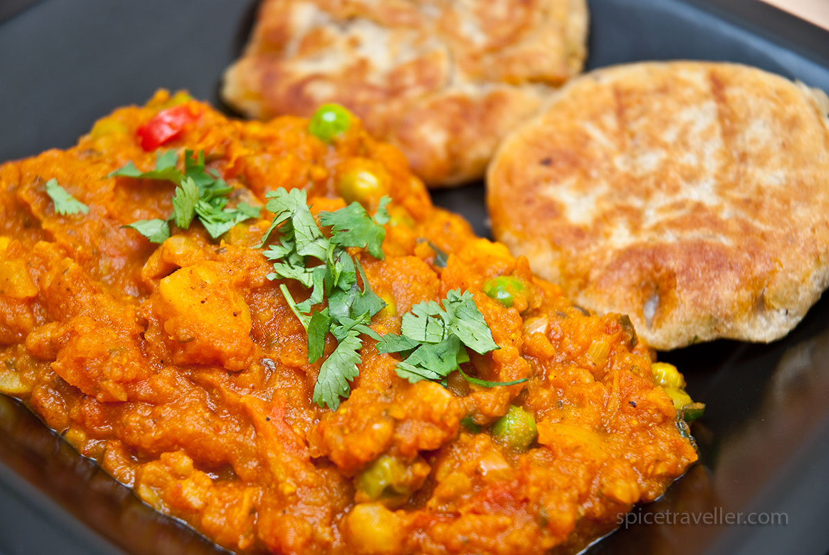 Delicious and flavorful pav bhaji dish, vegetable curry, served with buttered pav bread, an authentic pav bhaji recipe