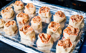 Mini Pizza Roll Pieces on Baking Tray - Bite-sized treats arranged and prepared for baking