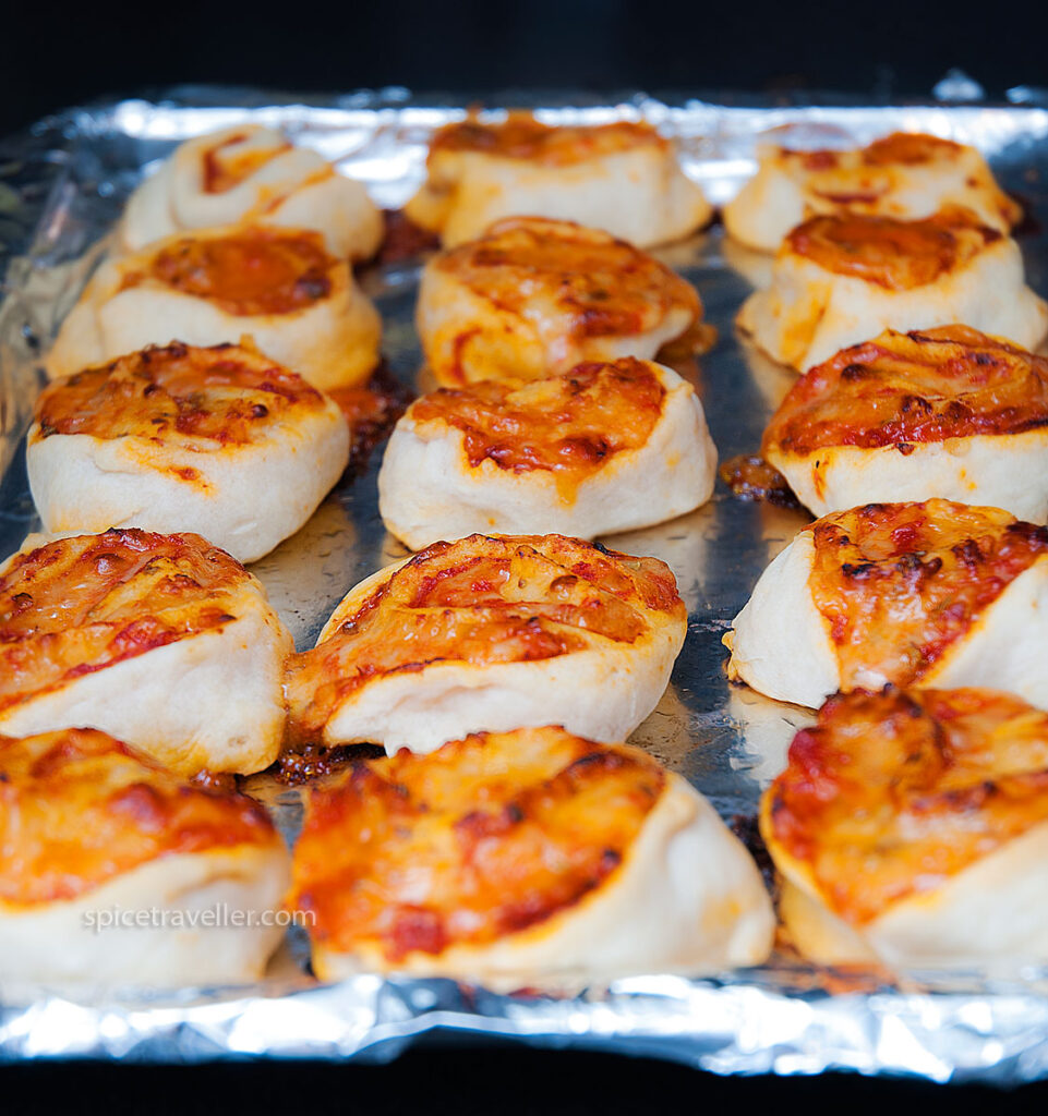Baked Mini Pizza Rolls - Golden and delicious bite-sized treats fresh out of the oven