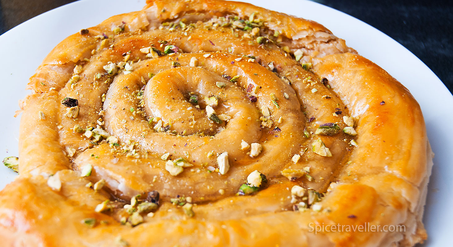 Baked M'hanncha with Syrup and Pistachios - Irresistible Moroccan Sweet Treat