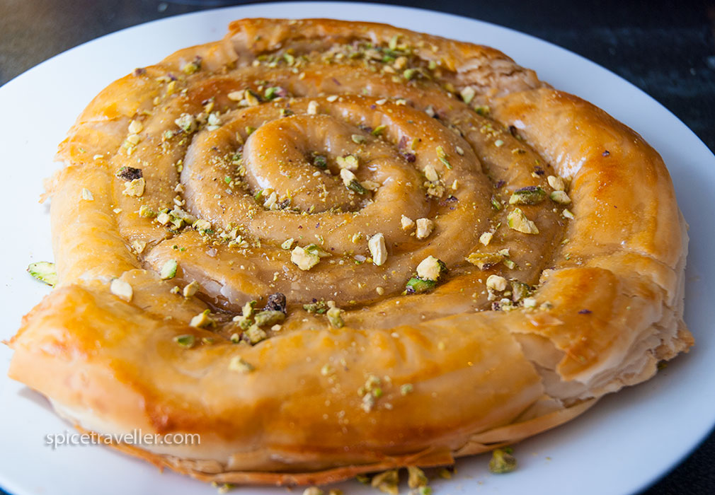 Baked M'hanncha with Syrup and Pistachios - Irresistible Moroccan Sweet Treat