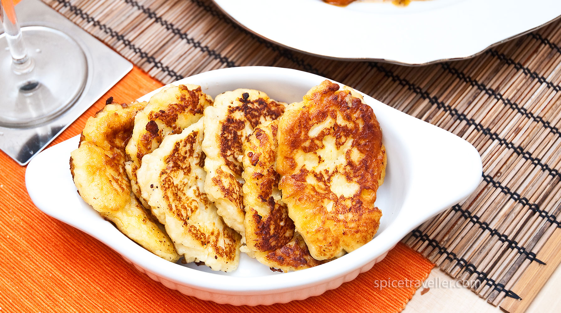Irresistible Irish Potato Bread Cakes, neatly arranged in a small dish, showcasing their golden brown exterior and inviting texture