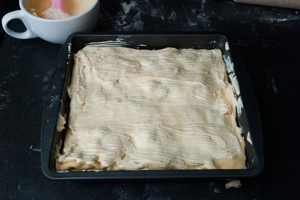 Layered butter bread with chicken ready to bake