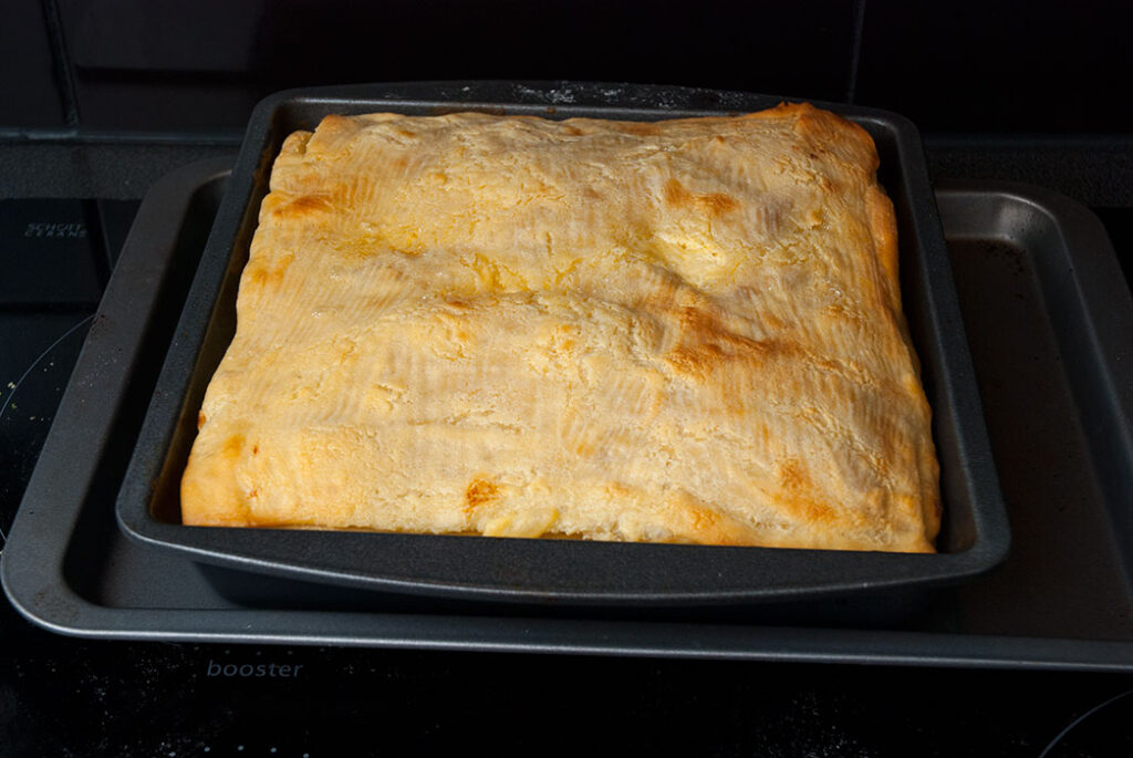 Layered butter bread with chicken out of the oven