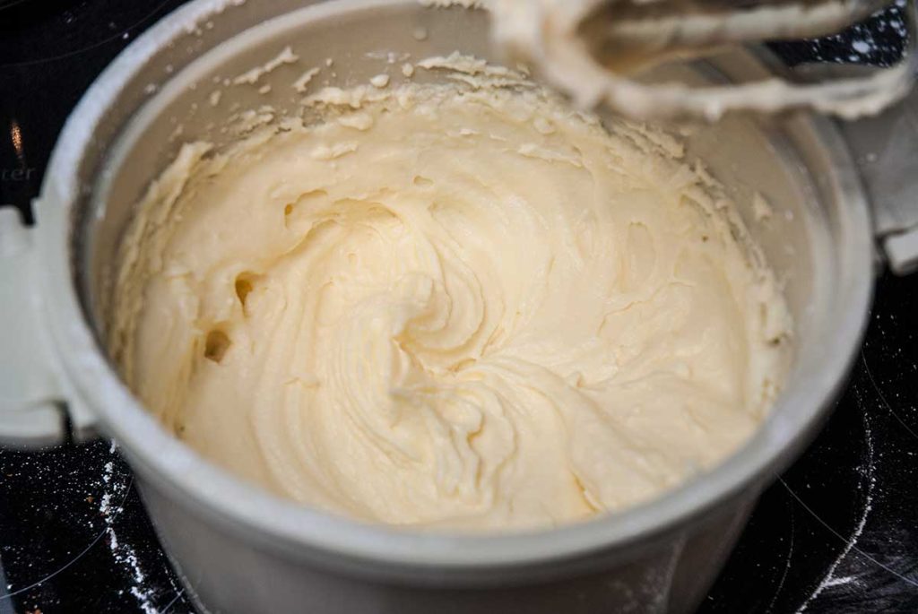 Making buttercream in a bowl.