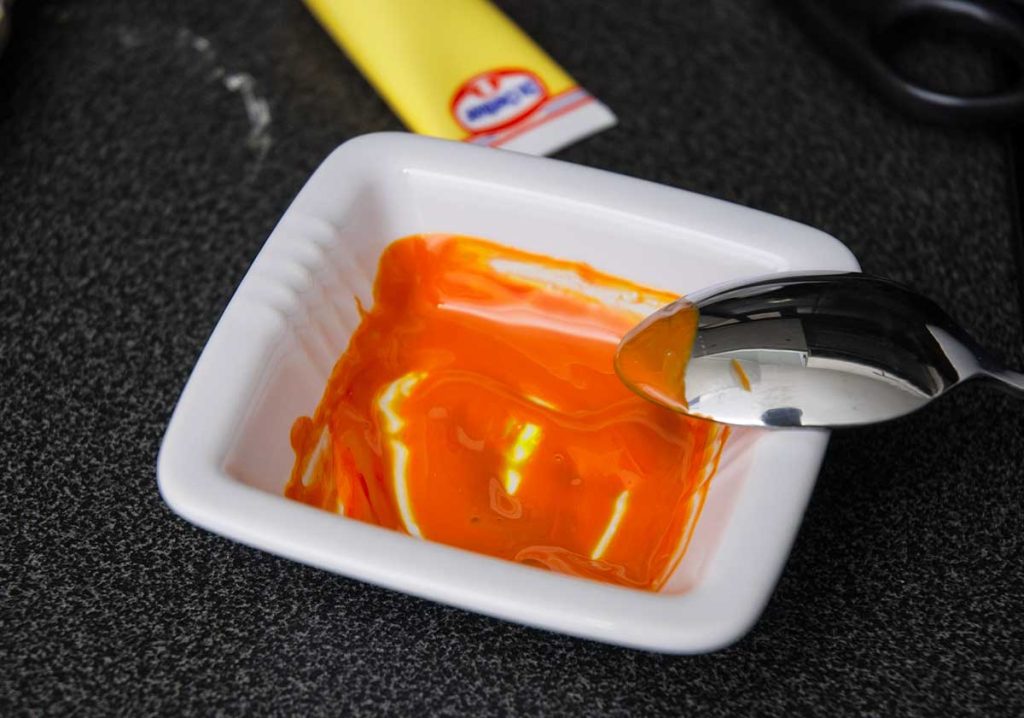 Orange colouring for pumpkin sponge cake layer.