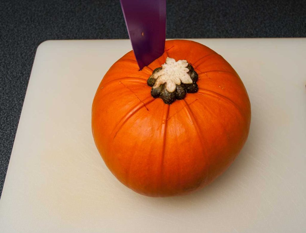 Making a few cuts in the mini pumpkin before roasting, to prevent bursting.