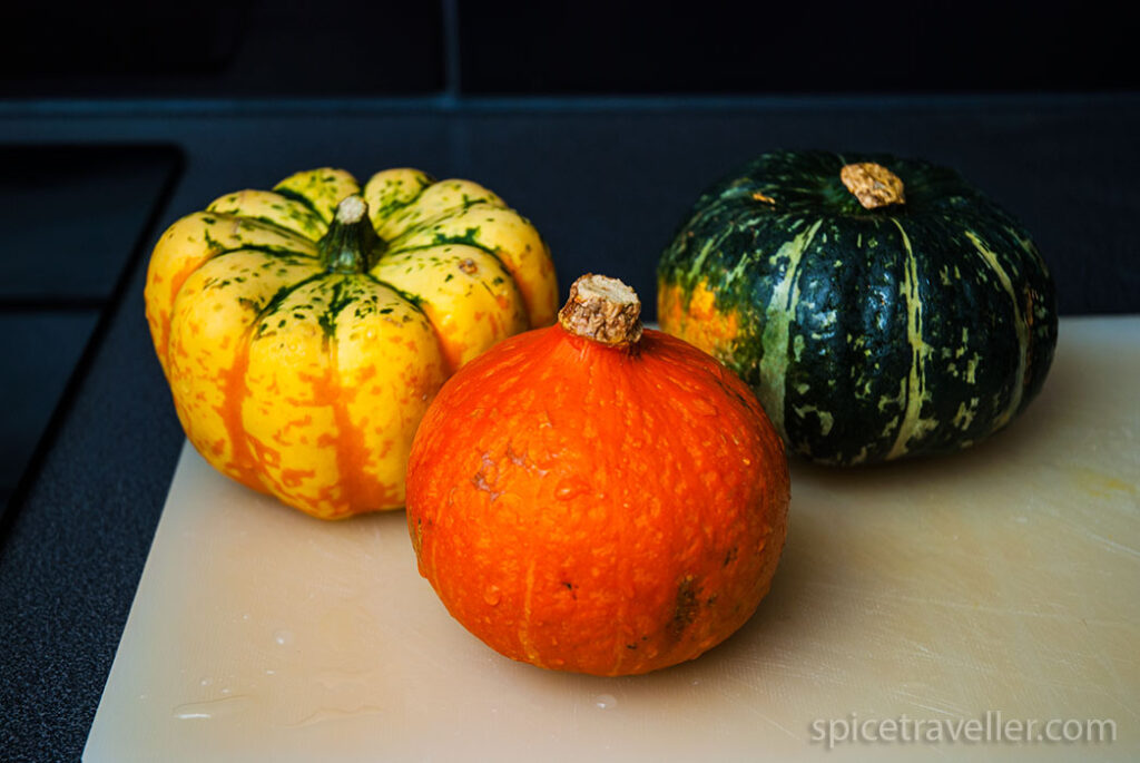 Three mini pumpkins ready to clean and use as serving bowls for risotto.