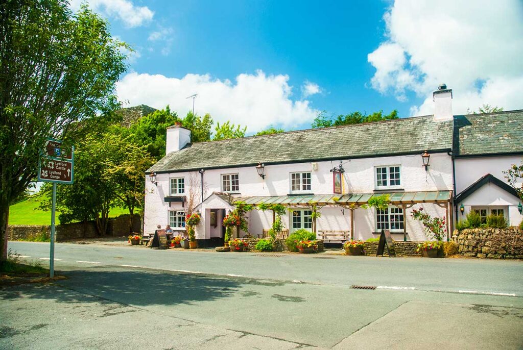 Charming old English pub from 16th century photographed from the outside, where they served roasted lamb with  sweet berry and balsamic sauce