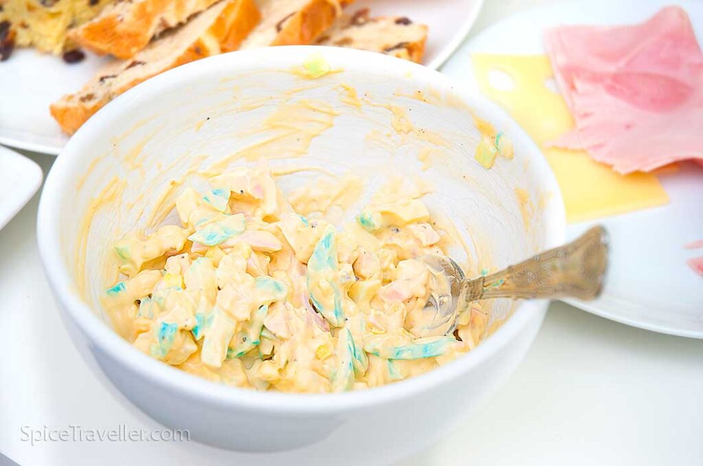 Ready made colourful easter egg-mayo spread in a bowl
