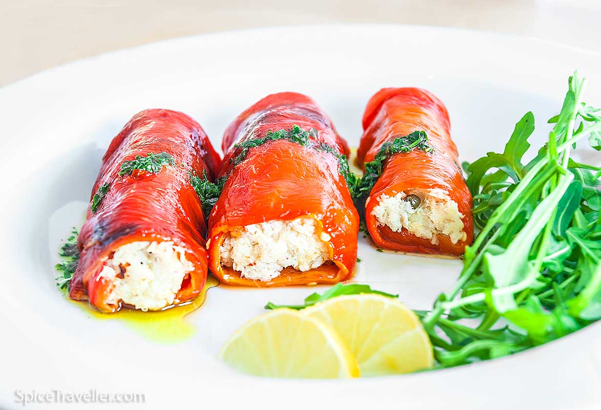 Three roasted pepper rolls stuffed with creamy fish and capers