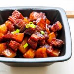 Black squared bowl with red-brasied chinese pork belly