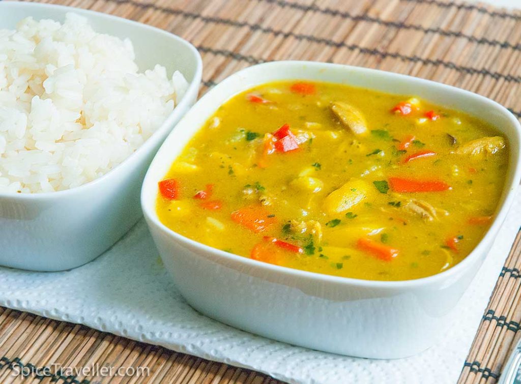 Serving suggestion - bowl of british chicken curry with a bowl of rice