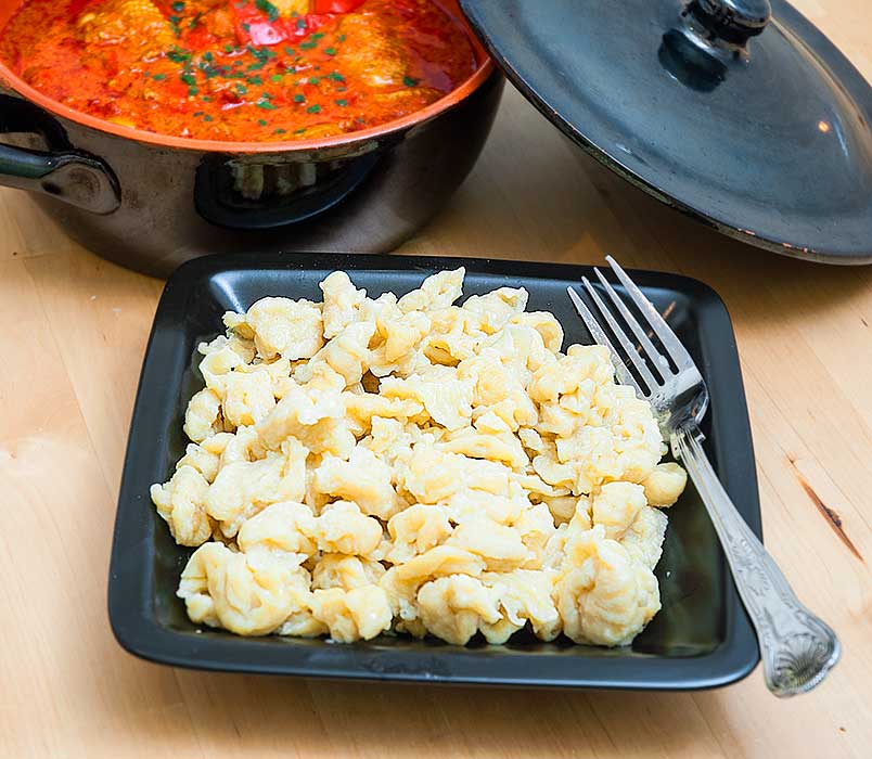 Bowl of freshly made Hungarian dumplings to be served with Hungarian chicken paprikash