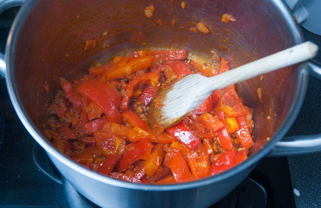 Making Hungarian base sauce with peppers, onion and tomato.