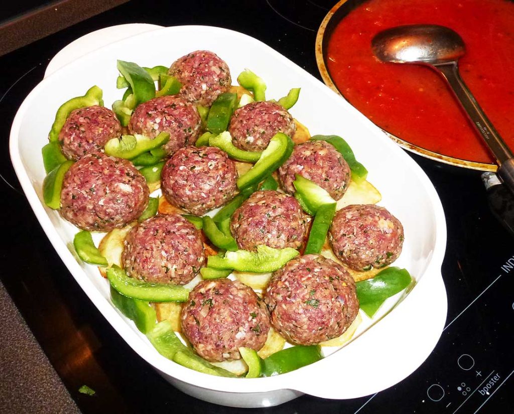 Turkish meatballs and peppers in a baking dish