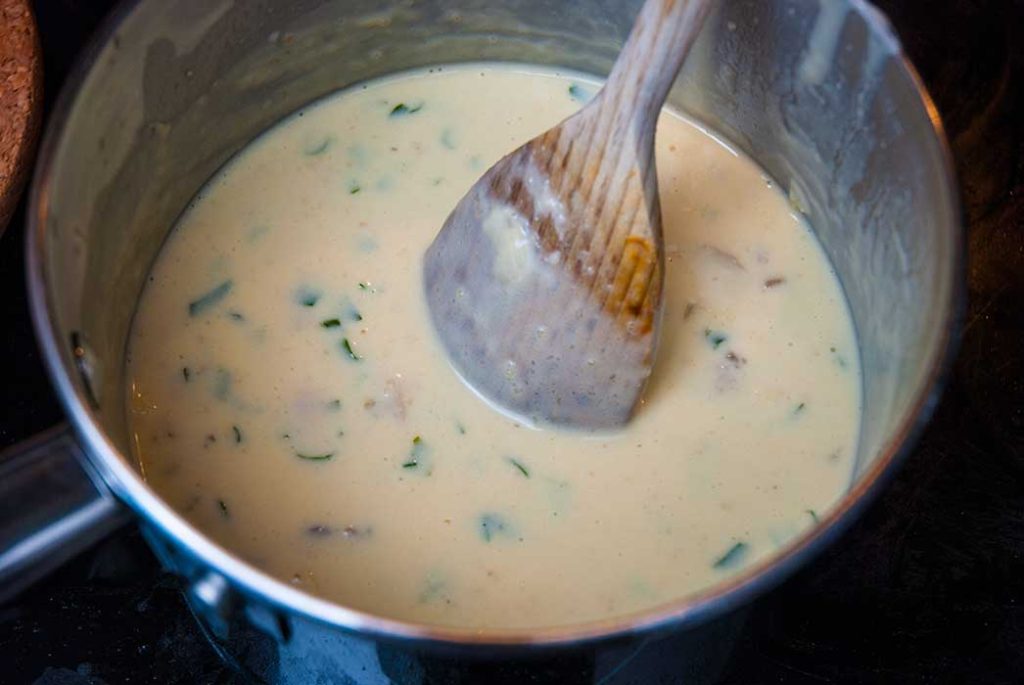 Creamy sauce ready to pour over fish and shellfish to make luxury seafood fish pie