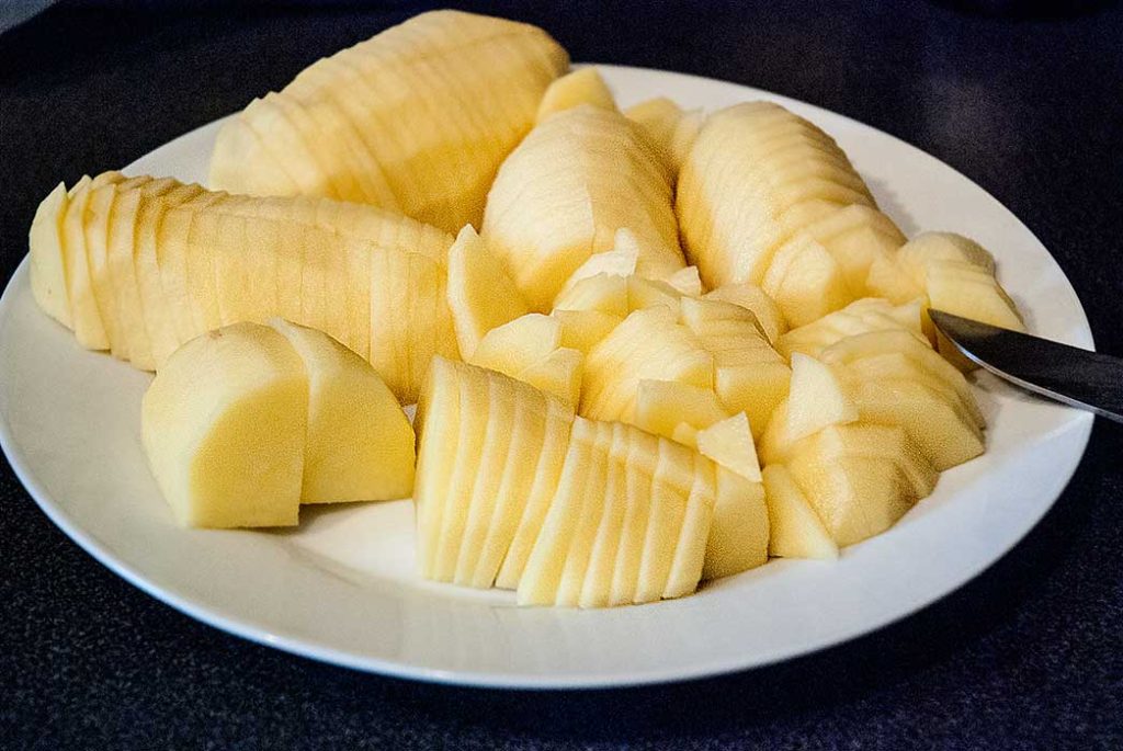 Raw potatoes peeled and thnly sliced