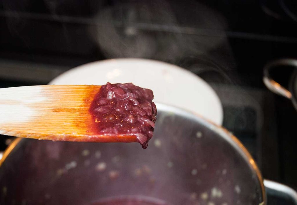 Close up of onions cooked  in red wine and ready for the next step in making Salisbury steak gravy.