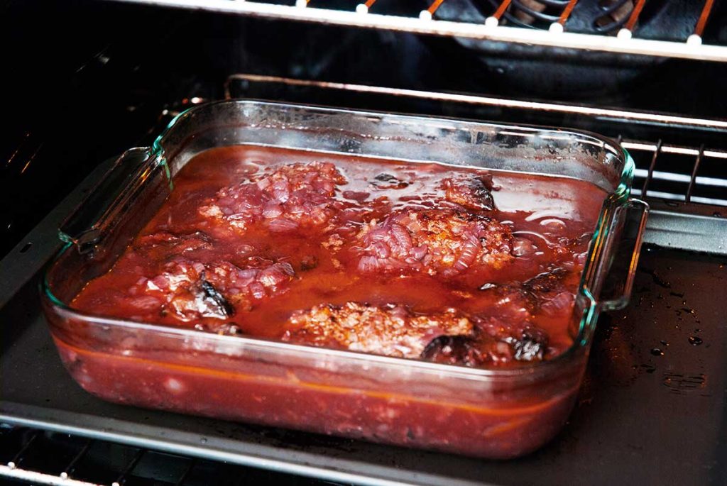 Perfectly baked Salisbury steaks or beef patties in red wine sauce.