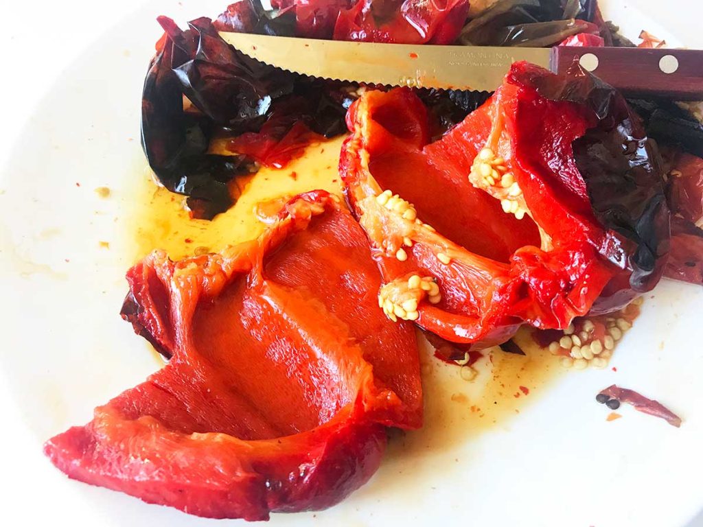 Fileting roasted bell peppers.