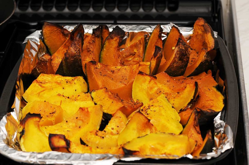 Tray with roasted pumpkin wedges