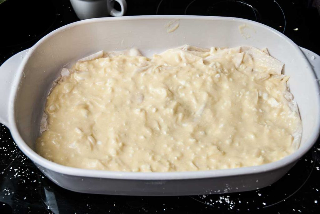 Banitsa cheese filling spread evenly over the filo dough.