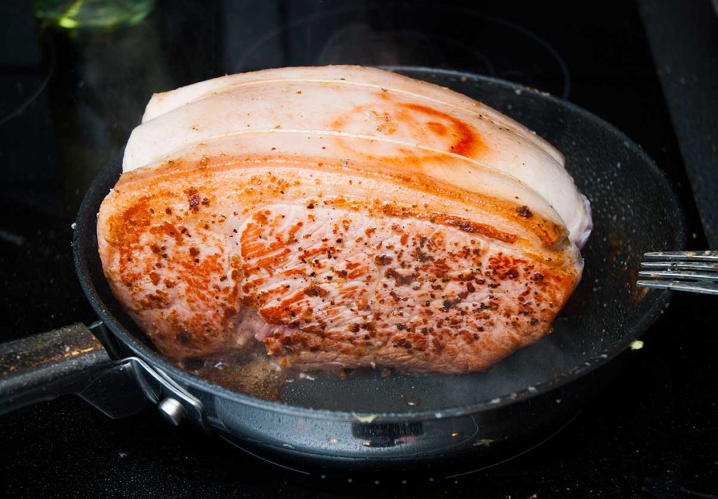 Perfectly seared boneless pork leg joint.