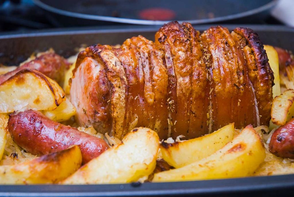 Pork loin roasted to perfection together with potato wedges and sauerkraut. 