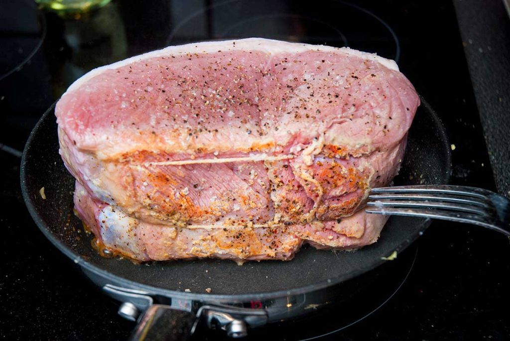 Searing the boneless pork leg joint