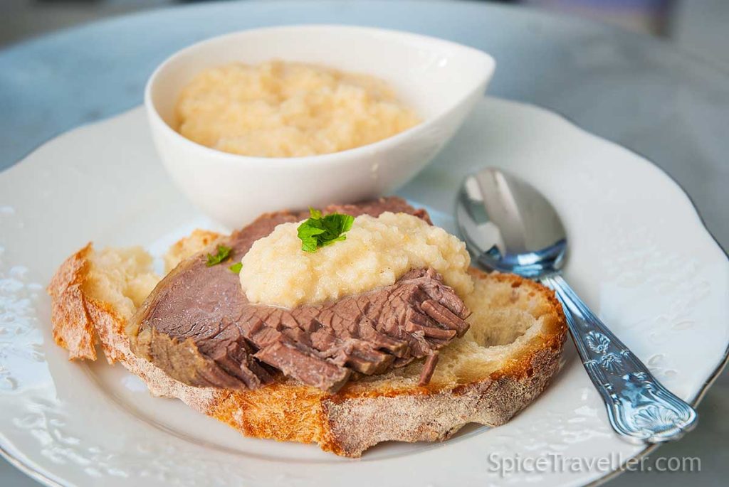 Serving suggestion - A slice of rustic bread with one slice of cold boiled beef Tafelspitz, topped with apple and horseradish sauce. 