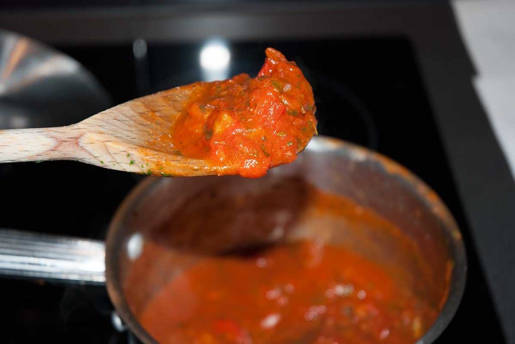 Close up of thick tomato and pepper sauce.