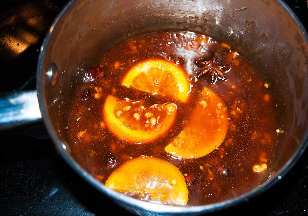 Delicious Chinese sweet orange sauce in a pot.