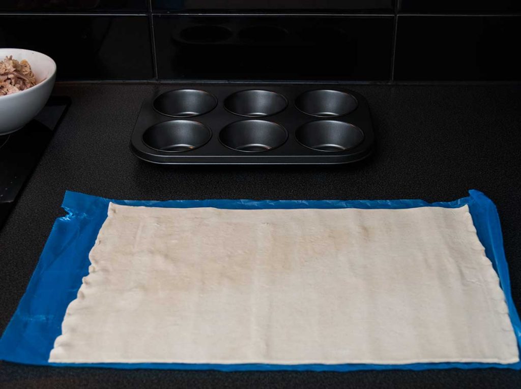 One sheet of ready made puff pastry dough ready to cut.