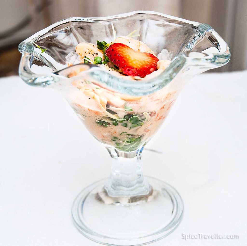 Sophisticated seafood cocktail with strawberry and prosecco dressing, decorated with a heart - a slice of strawberry. 