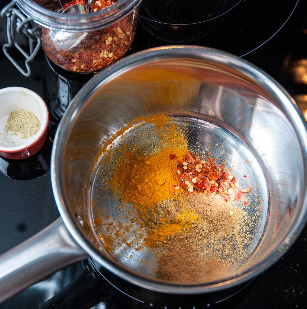 Emirati spices in a small pot ready to toast.