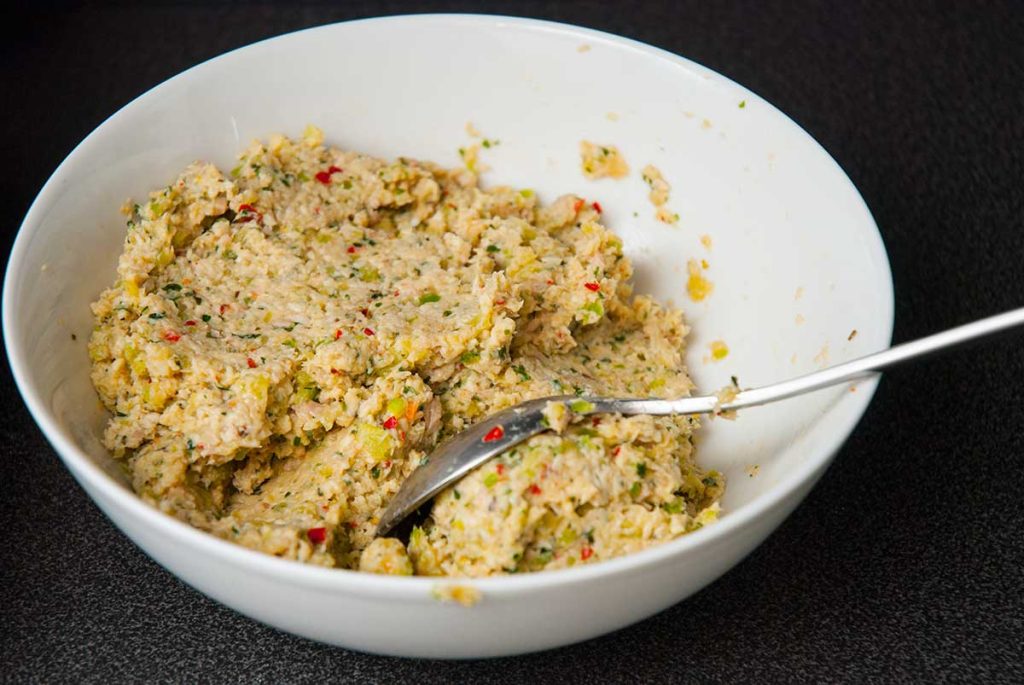 Spicy Thai Chicken burger mixture in a white bowl, ready to shape burgers.