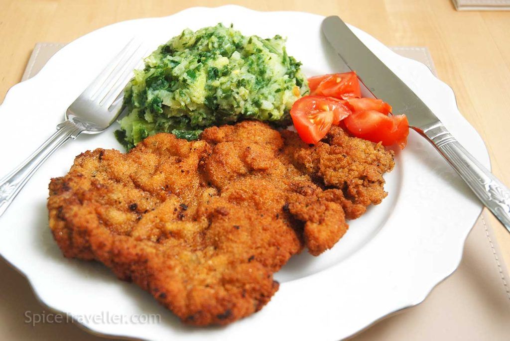 Serving suggestion - chard and potato mash served with pork escalope and tomato salad.