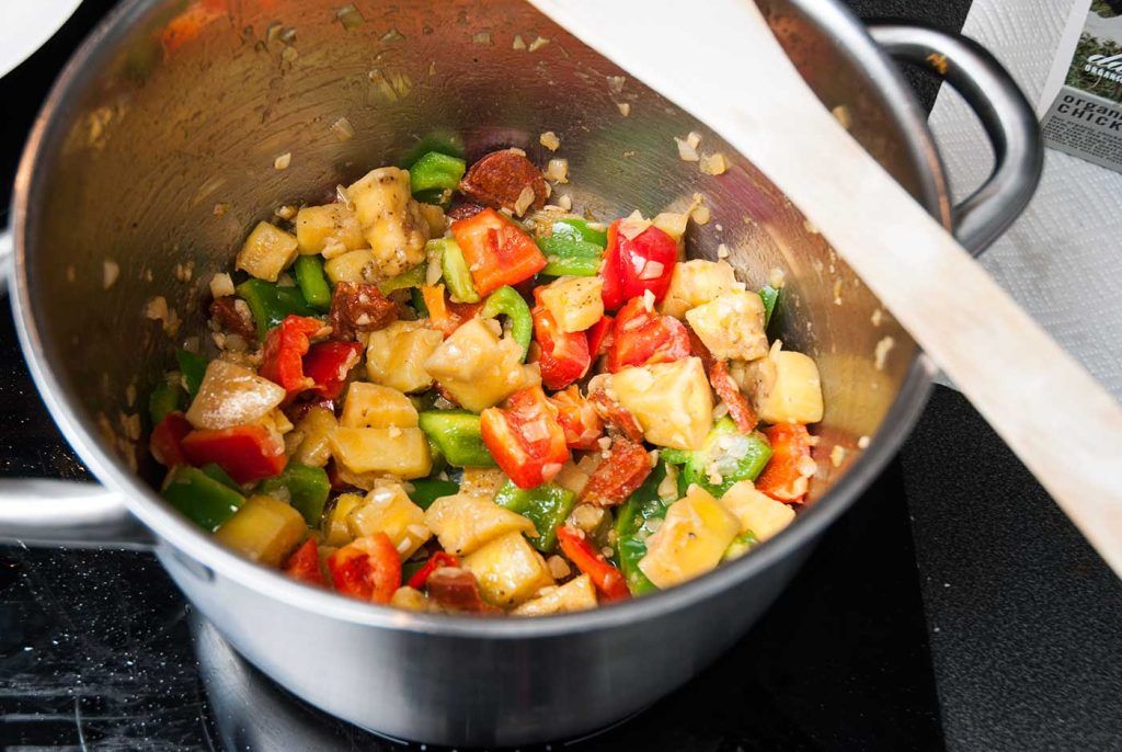 Frying bell peppers with onions and Chorizo.