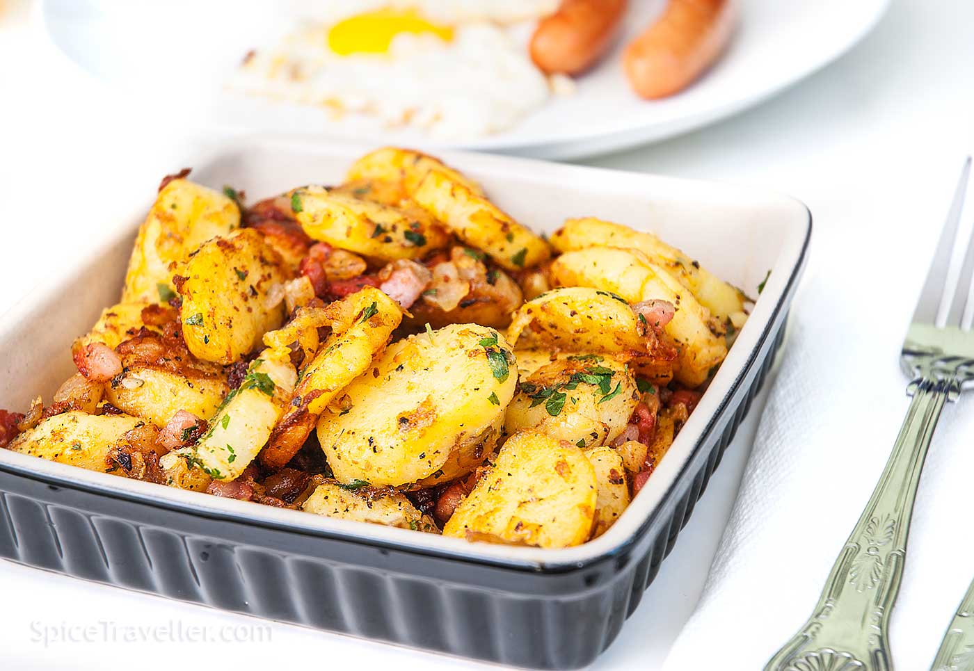German fried potato with bacon and onion elegantly served as a side dish.