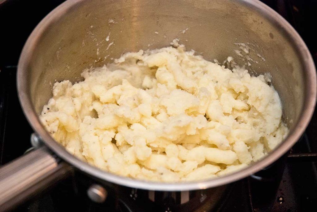 Mashed potato in a pot ready to make British Fish Pie.