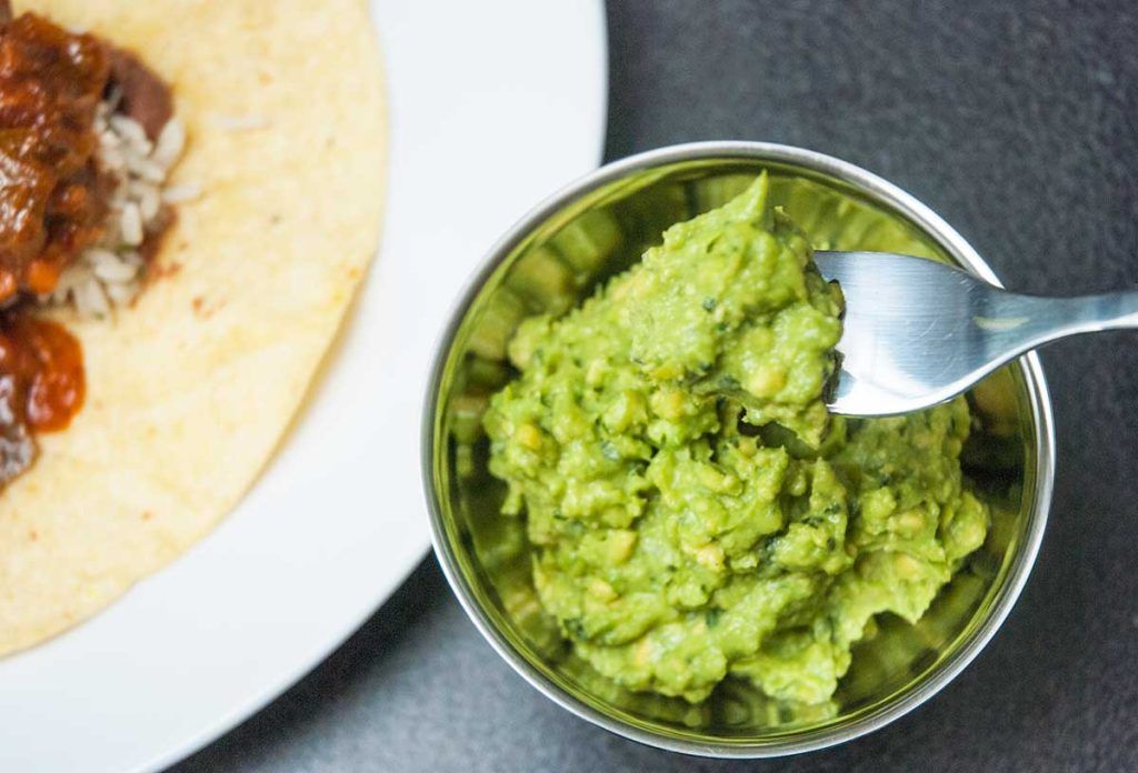Simple guacamole close up on a fork,