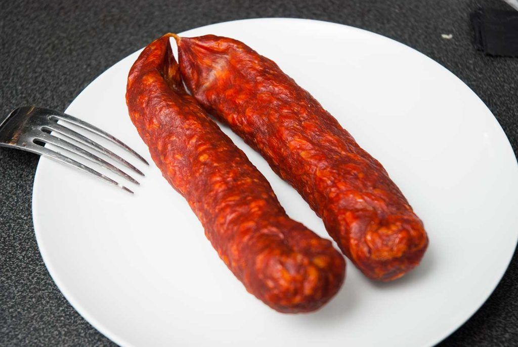 Two Chorizo spicy sausages, ready to chop for Turkish chicken and bulgur bake (guvec).
