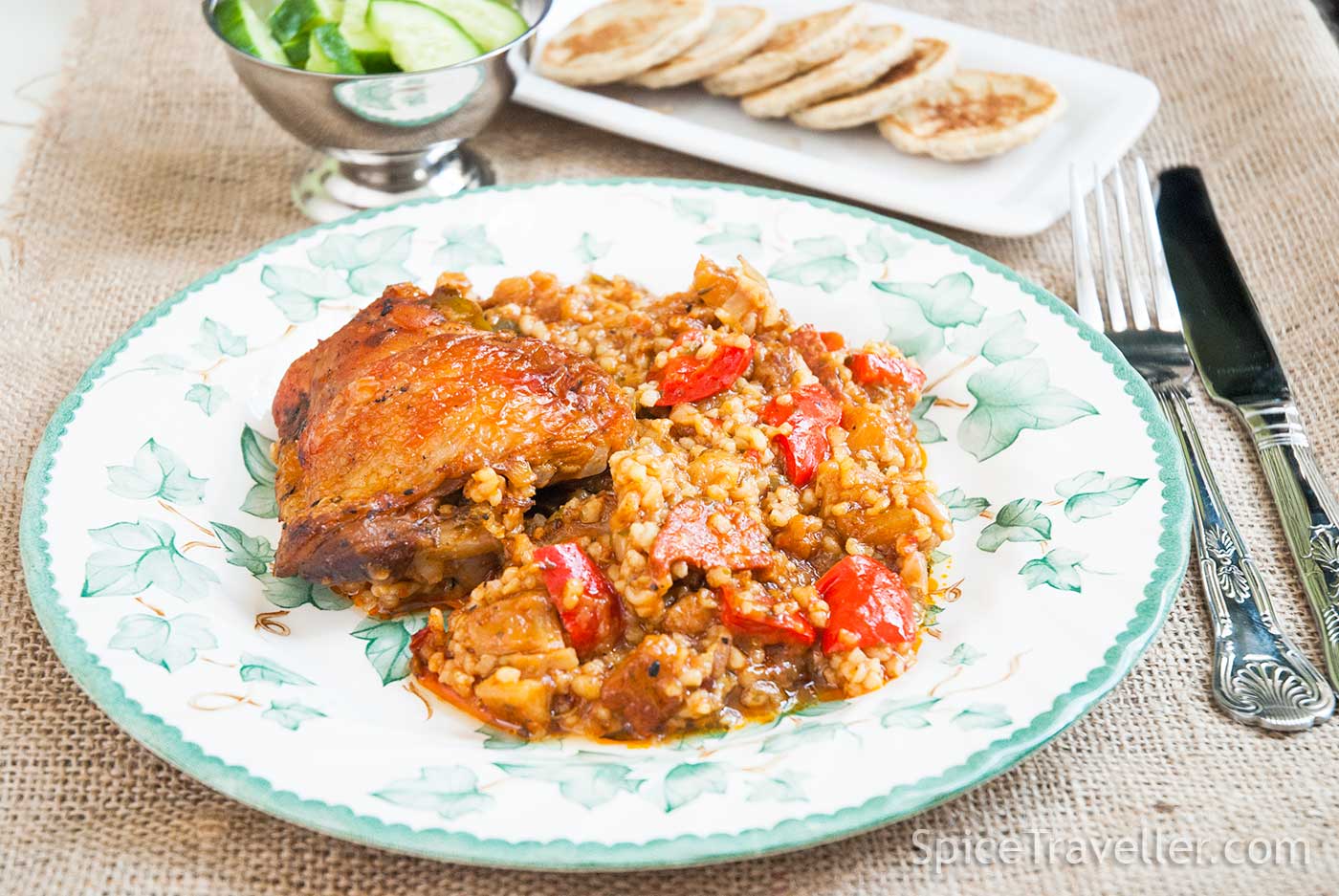 Turkish chicken and bulgur bake served with cucumber and mini pita breads.