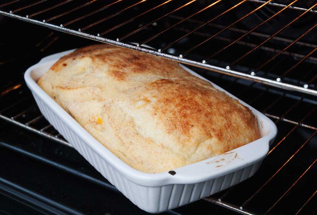Baked bread and butter pudding, puffed up straight from the oven.