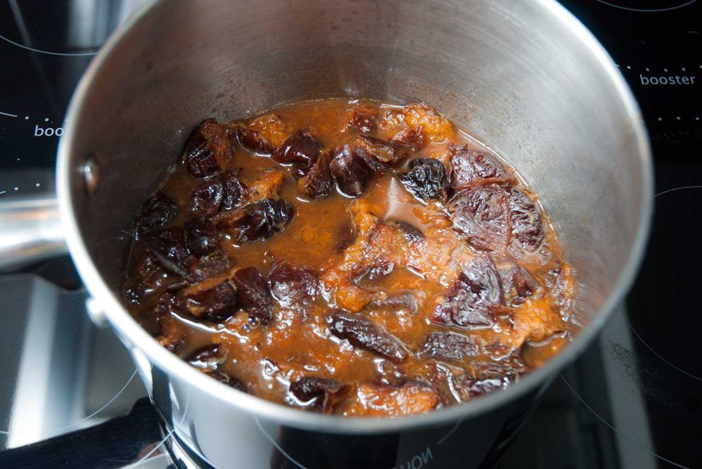Soft, plump prunes after cooking in a saucepan