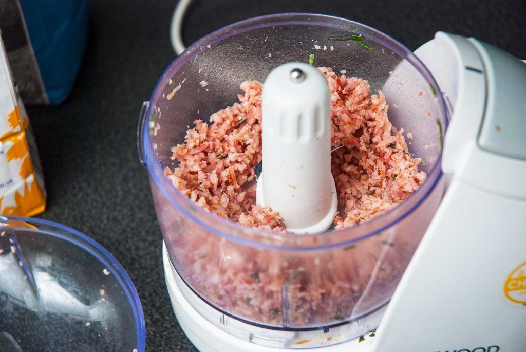Fried bacon and rosemary chopped in a food processor for damper dough.